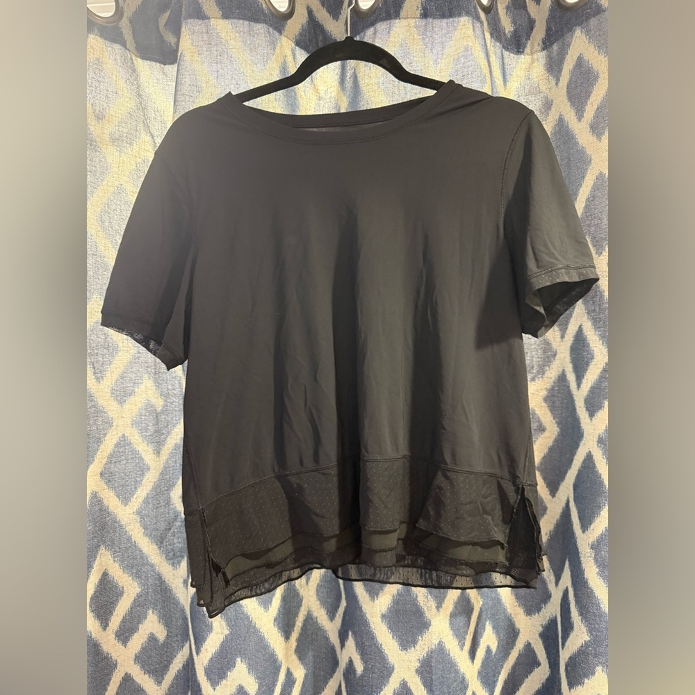 Lululemon Black Tee with mesh overlay bottom estimated size 8/10
